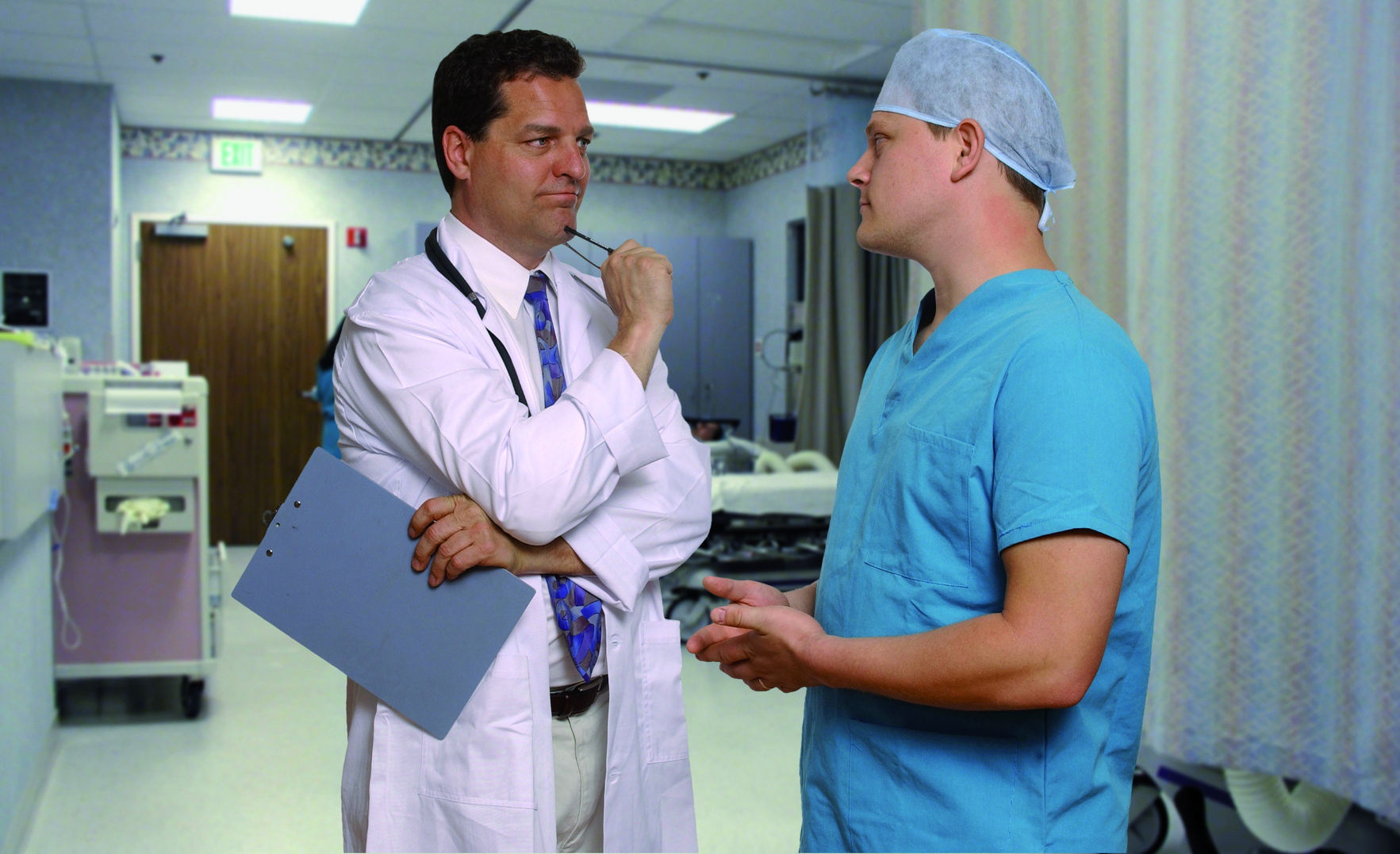 doctor and surgeon consult in recovery room